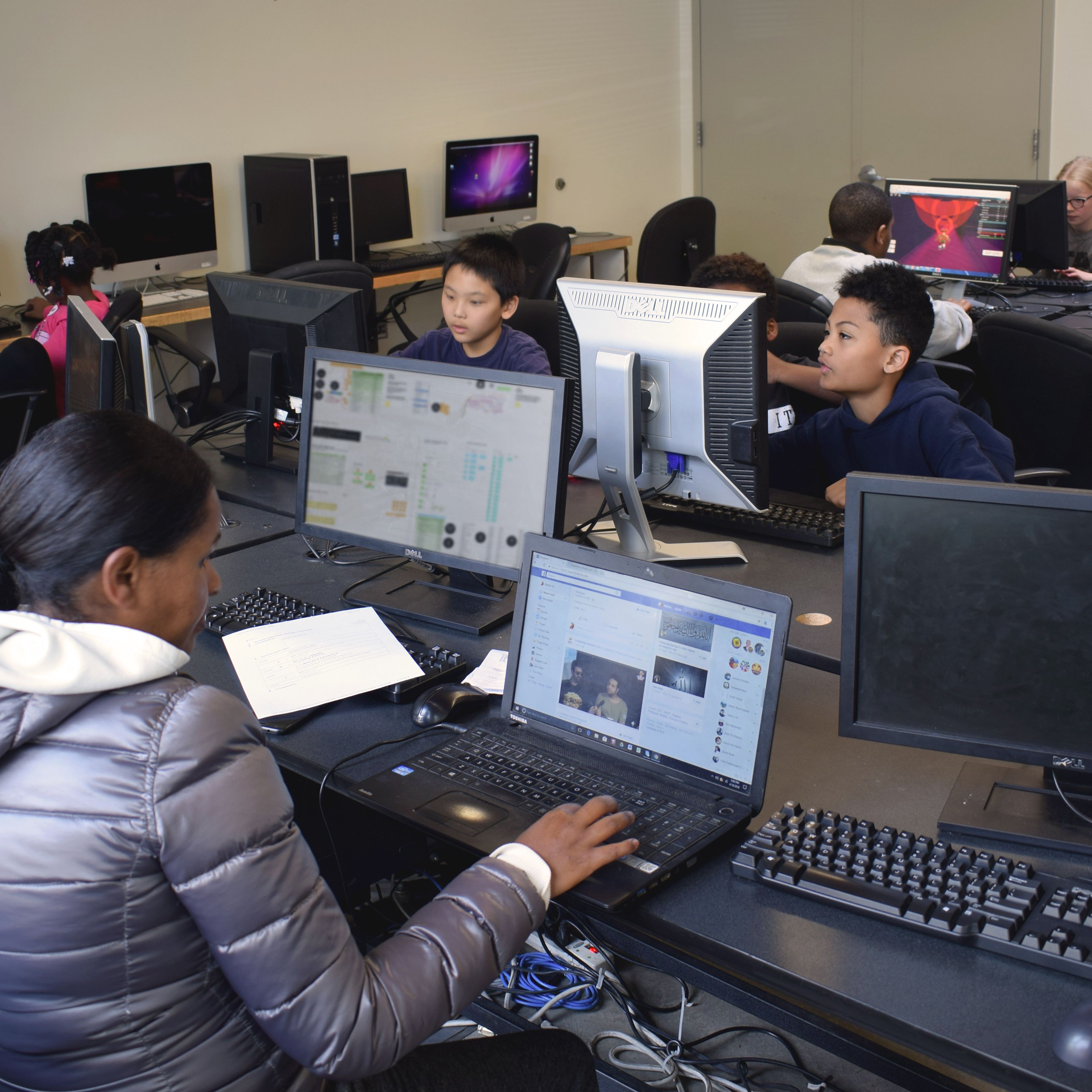 Youth using computers in a group setting